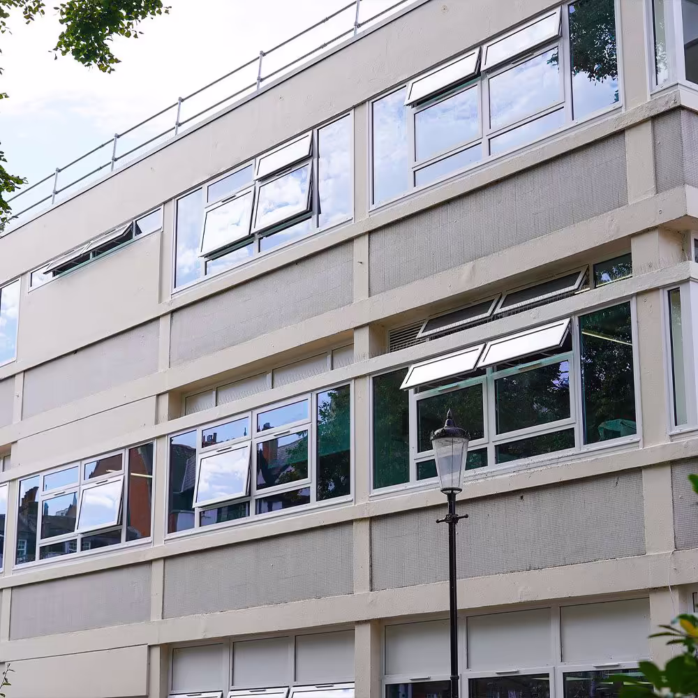 Interior view of a room with freshly painted reveals around a newly fitted double-glazed window.