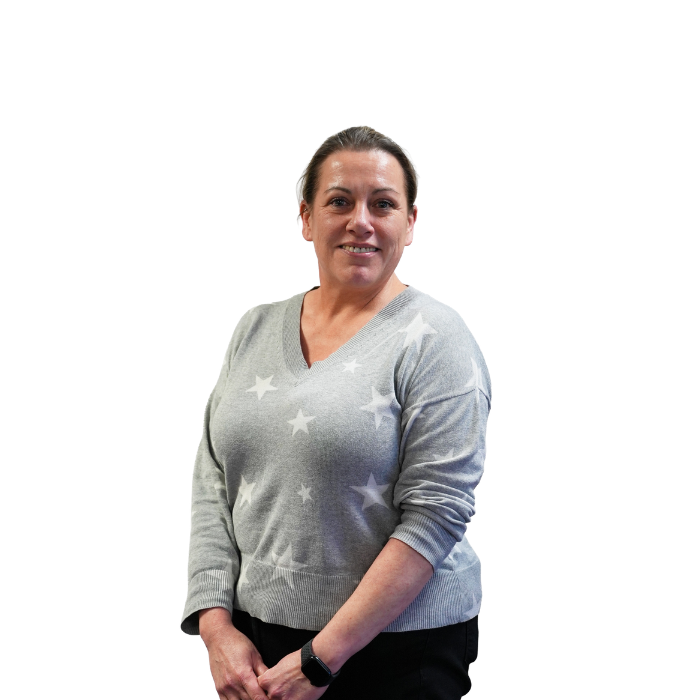 Smiling woman in a grey jumper and light grey stars. White background