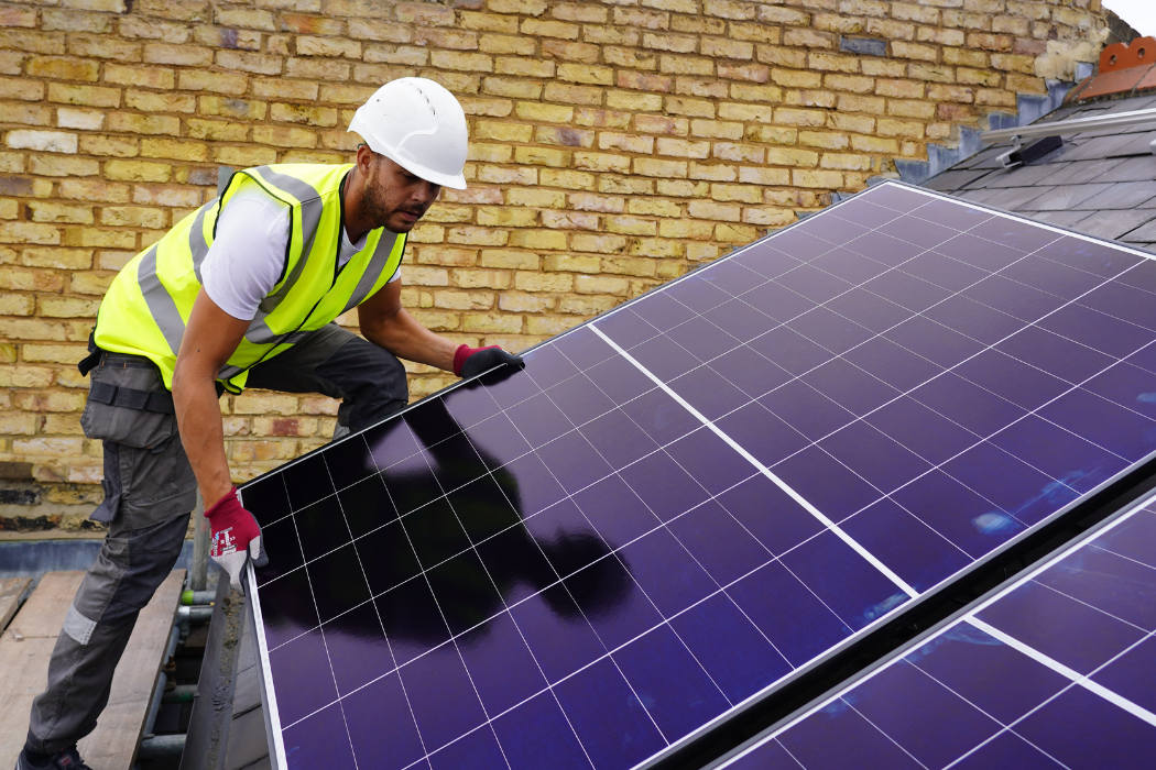CLC operative installing a Solar PV panel